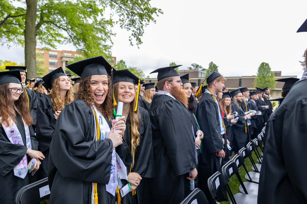 Students pose at graduation.