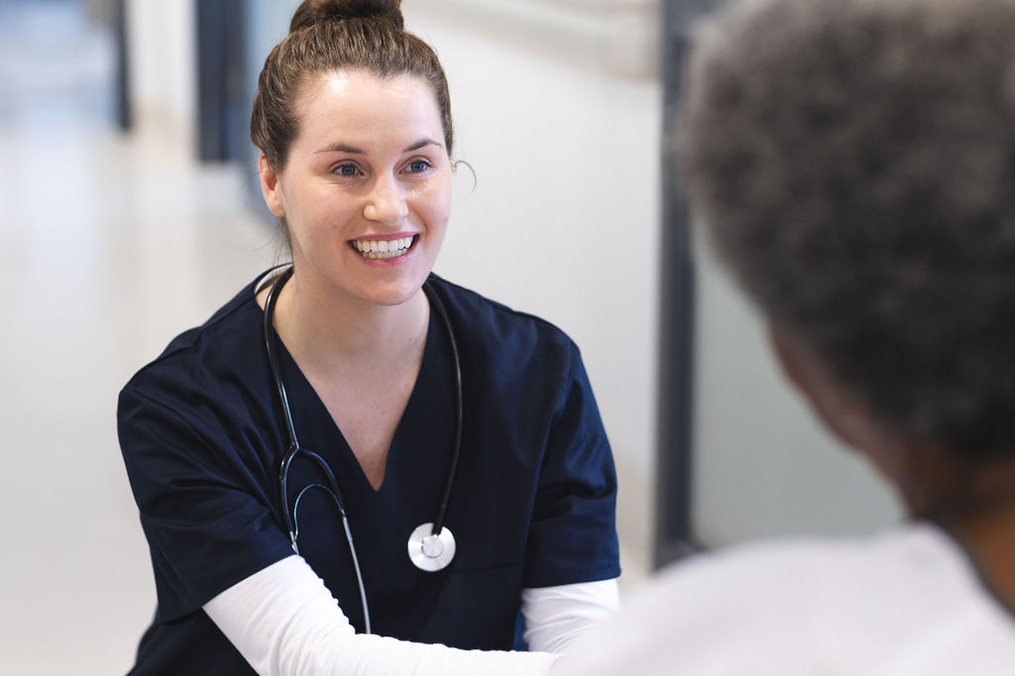 Nurse smiles at patient.