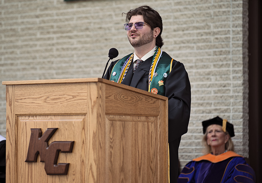 Peyton Taylor speaking at podium