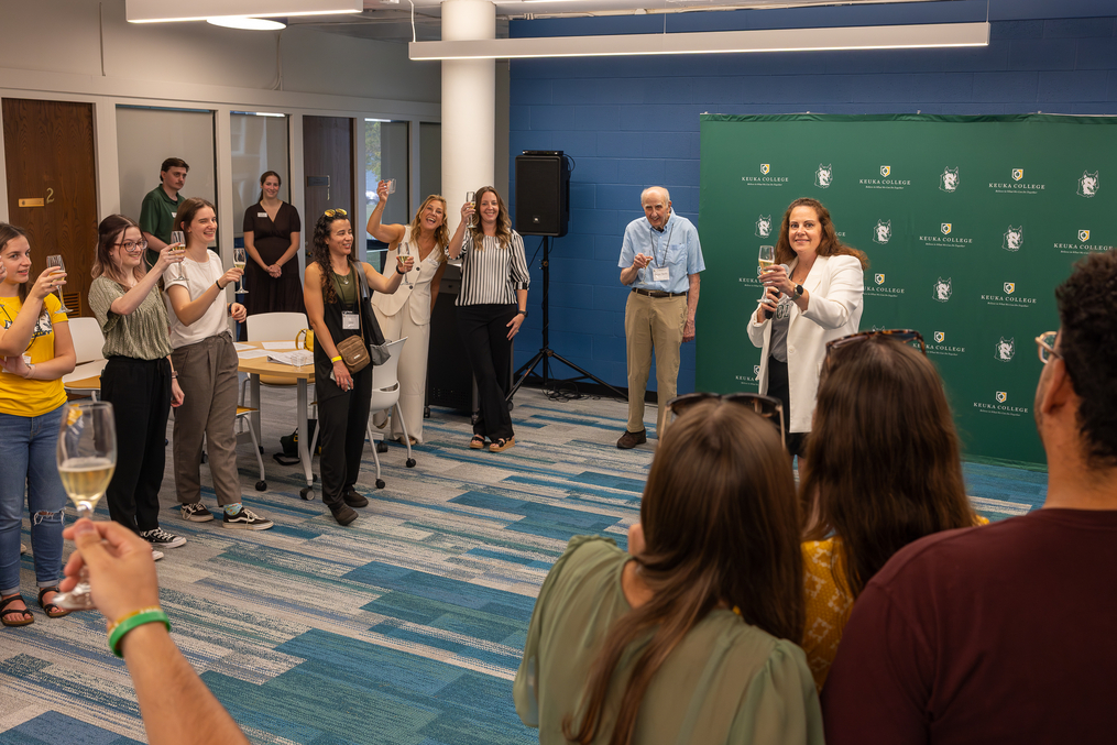 Provost and Vice President for Academic Affairs Dr. Heather Maldonado leads a toast to former Division of Occupational Therapy Chair Dr. Peter Talty during a celebration of the OT program’s 40th anniversary.